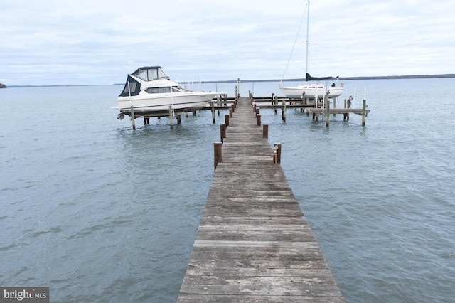 dock area featuring a water view and boat lift