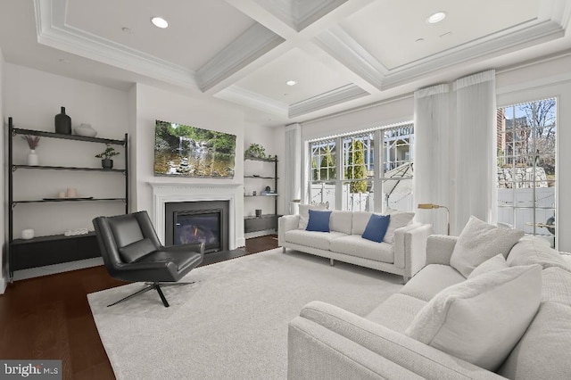 living room featuring a fireplace with flush hearth, coffered ceiling, a healthy amount of sunlight, and wood finished floors