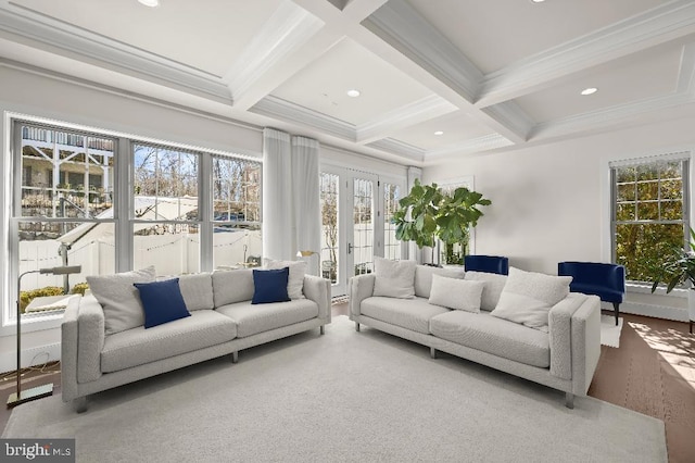 living area featuring coffered ceiling, recessed lighting, french doors, crown molding, and beamed ceiling