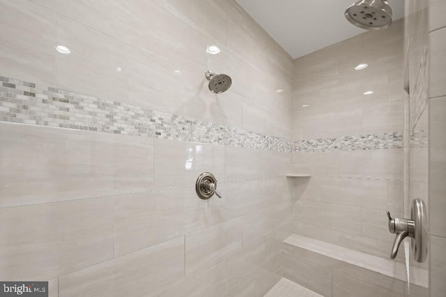 full bathroom with tiled shower