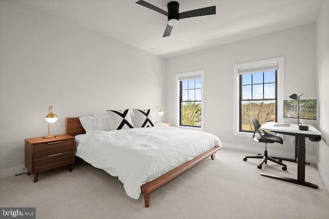 bedroom with baseboards, ceiling fan, and carpet flooring