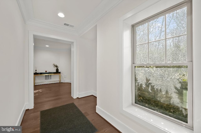 hall with baseboards, visible vents, recessed lighting, ornamental molding, and dark wood-type flooring