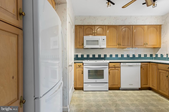 kitchen featuring backsplash, wallpapered walls, light countertops, white appliances, and a ceiling fan