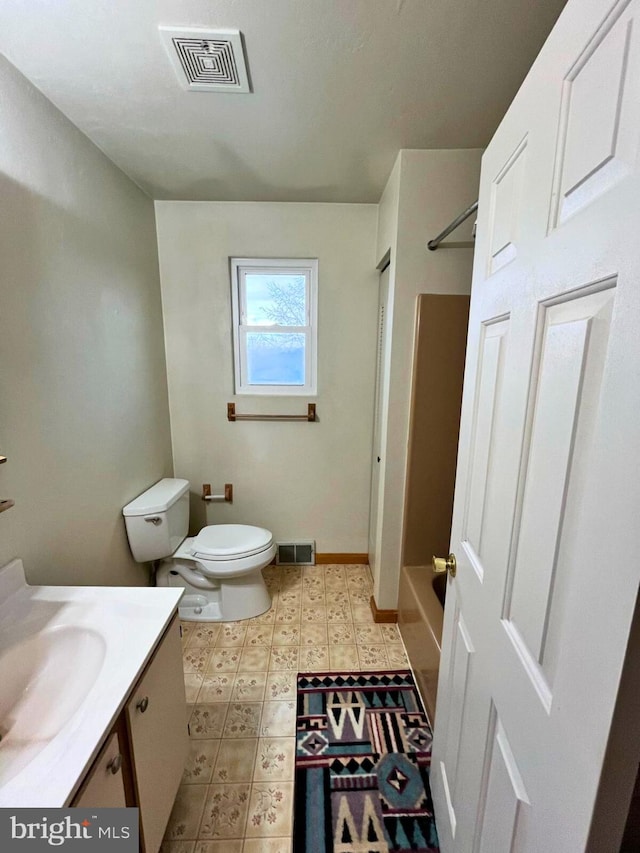 bathroom featuring tile patterned floors, visible vents, toilet, and vanity