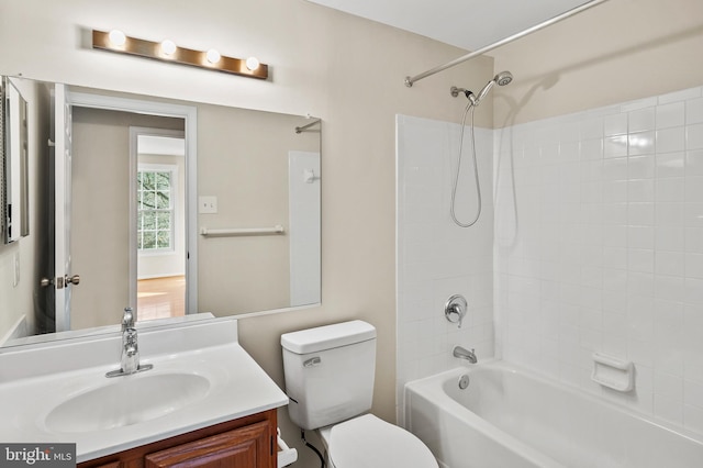 bathroom with toilet, vanity, and shower / bathing tub combination