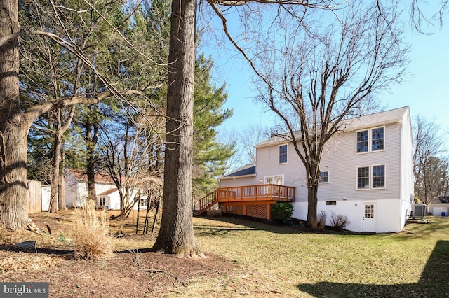 view of yard featuring cooling unit and a wooden deck