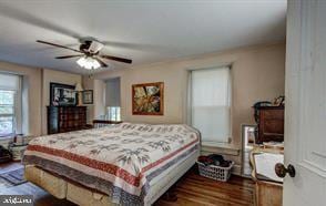 bedroom featuring dark wood-type flooring