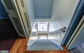 staircase featuring wood finished floors