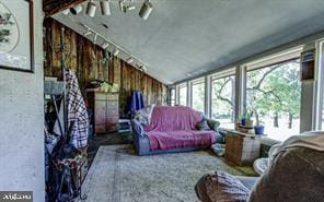 sunroom / solarium with vaulted ceiling