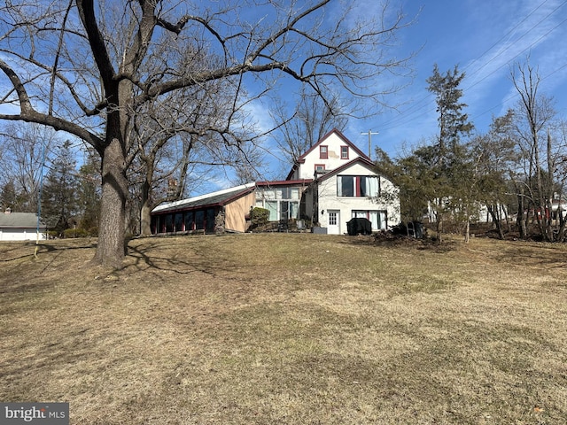 traditional-style house with a front lawn