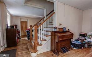 stairs with wood finished floors