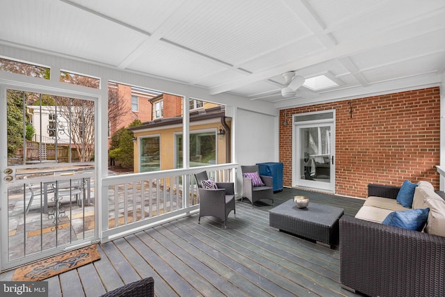 deck featuring an outdoor hangout area and a ceiling fan