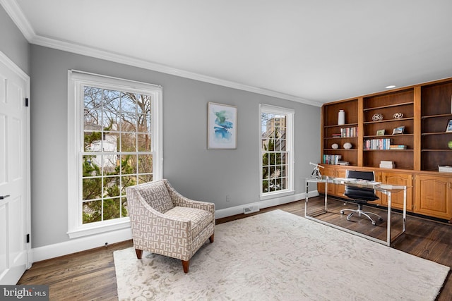 office space featuring dark wood finished floors, visible vents, baseboards, and ornamental molding