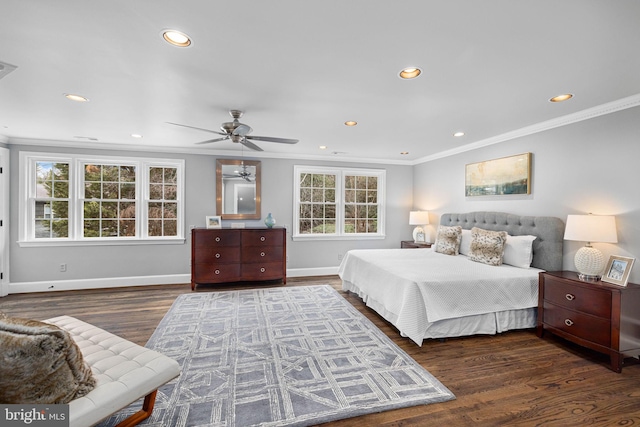 bedroom with wood finished floors, baseboards, and ornamental molding