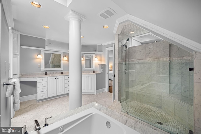 bathroom with visible vents, a garden tub, a stall shower, decorative columns, and vanity