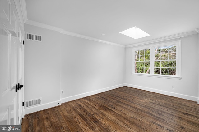 unfurnished room featuring visible vents, a skylight, and crown molding