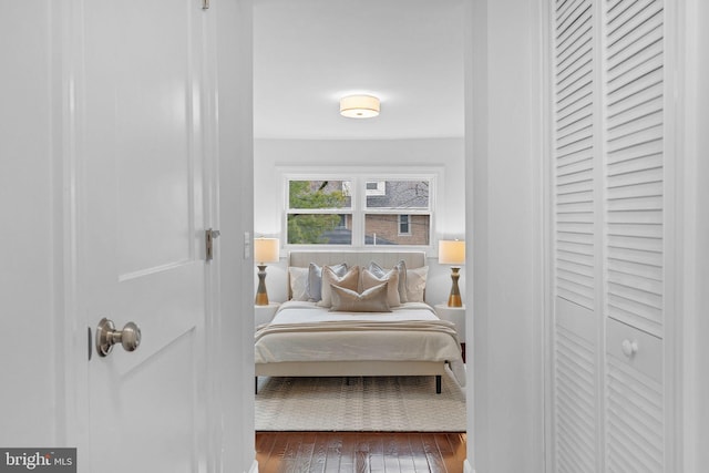 bedroom with hardwood / wood-style floors