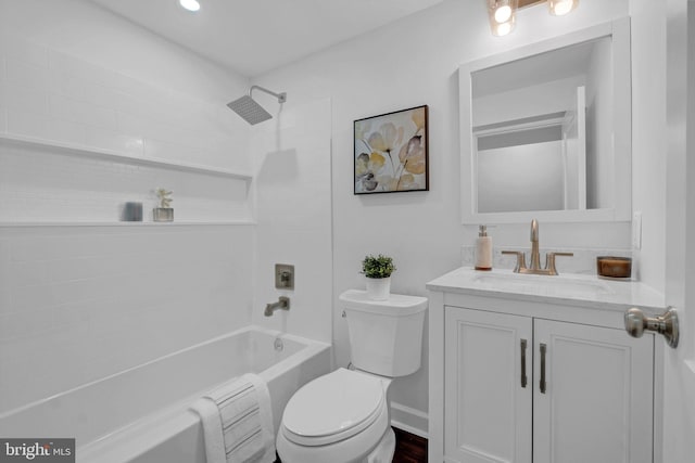 bathroom with shower / bathtub combination, toilet, and vanity