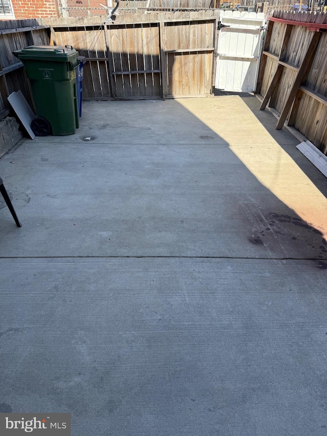 view of patio featuring a gate and fence