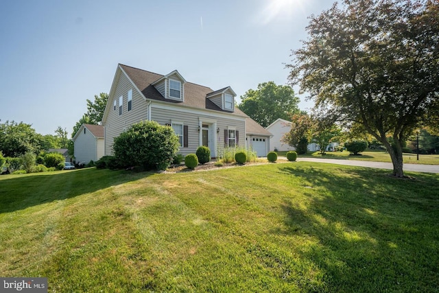 cape cod house with a front lawn, an attached garage, and driveway