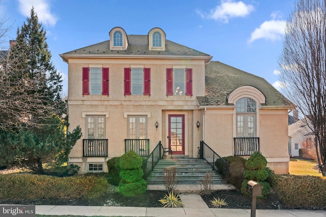 view of front of home featuring french doors and stucco siding