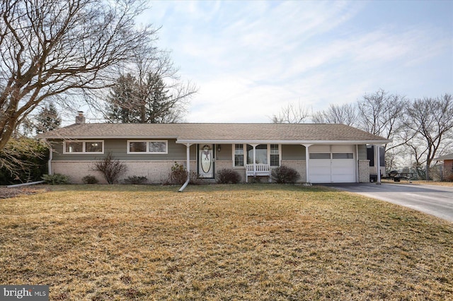 single story home with a front lawn, covered porch, brick siding, and a chimney