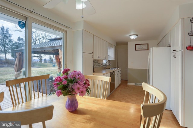 dining space featuring ceiling fan