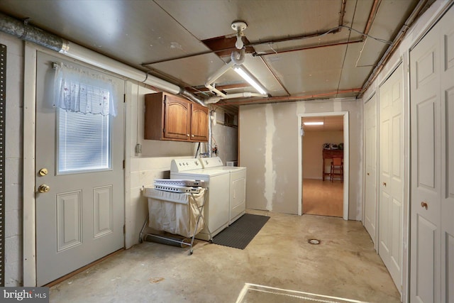 interior space featuring washer and dryer and cabinet space