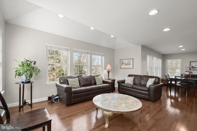 living area with vaulted ceiling, recessed lighting, baseboards, and wood finished floors