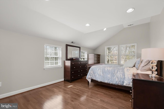 bedroom with visible vents, lofted ceiling, wood finished floors, recessed lighting, and baseboards