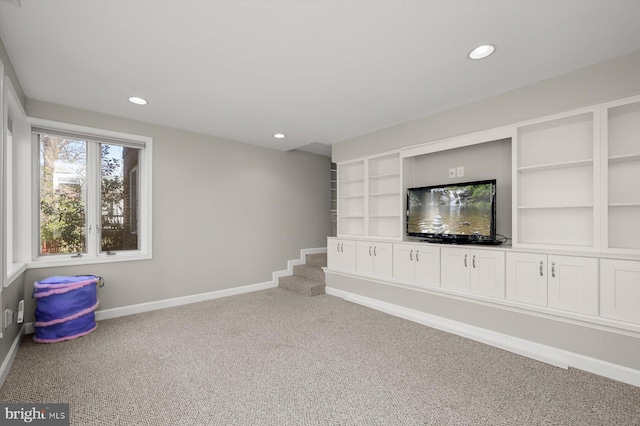 basement with recessed lighting, baseboards, and carpet