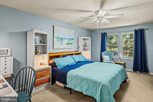 bedroom featuring baseboards, carpet floors, and ceiling fan