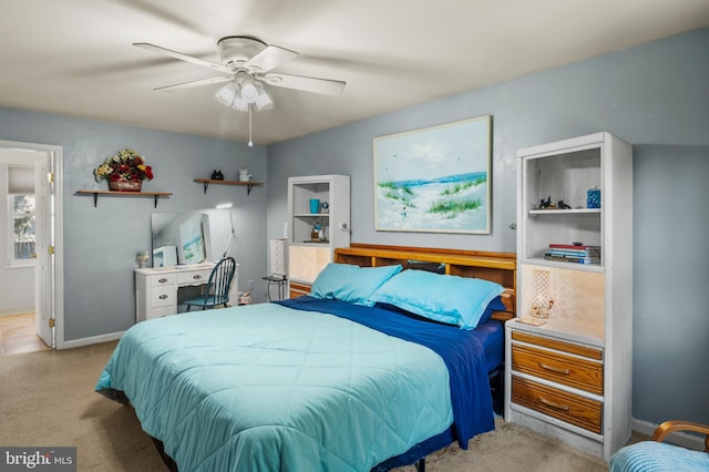 bedroom featuring carpet flooring, baseboards, and ceiling fan