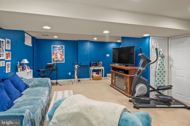 carpeted living room with recessed lighting and baseboards