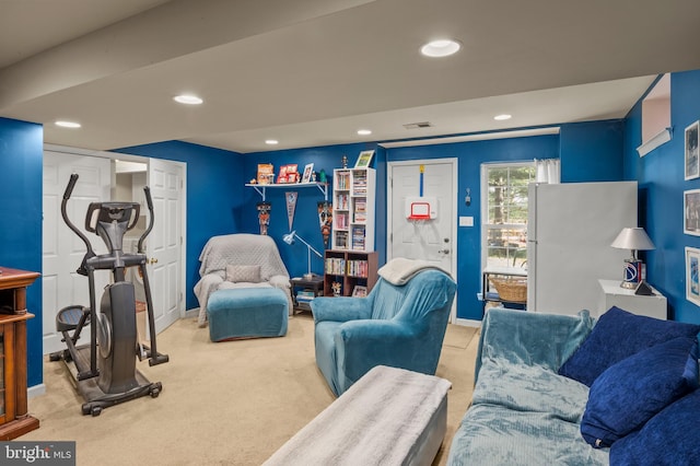 carpeted living room with visible vents, recessed lighting, and baseboards