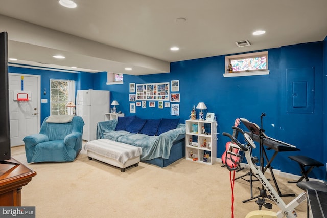 carpeted bedroom with visible vents, electric panel, recessed lighting, freestanding refrigerator, and multiple windows