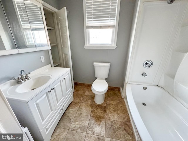 full bath with baseboards, toilet, and vanity