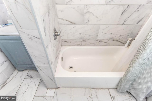 bathroom with marble finish floor