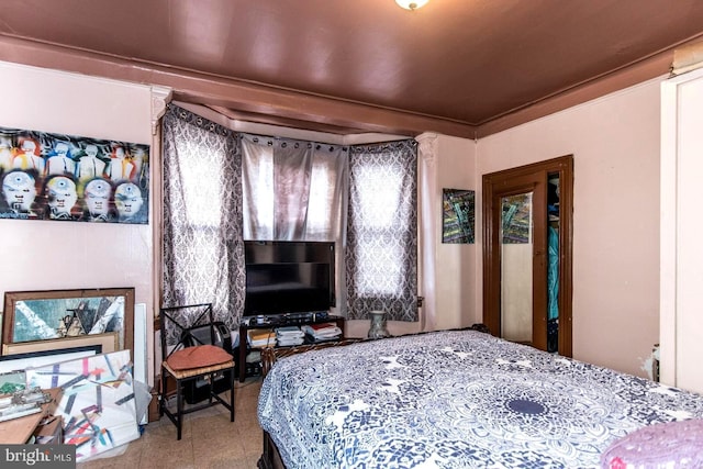 bedroom with crown molding