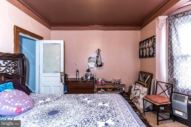 bedroom with crown molding