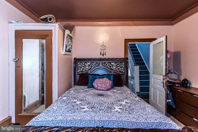 bedroom with ornamental molding