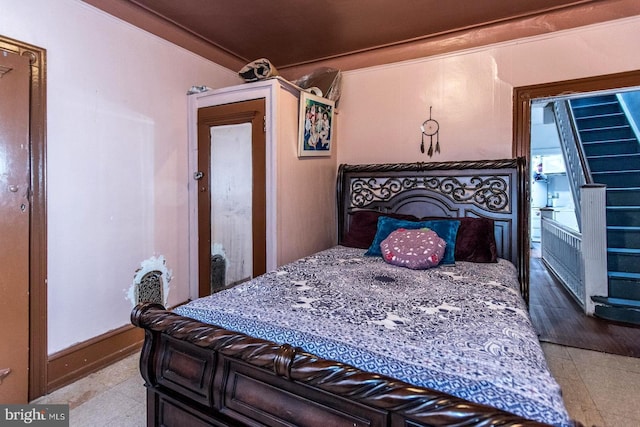 bedroom with crown molding