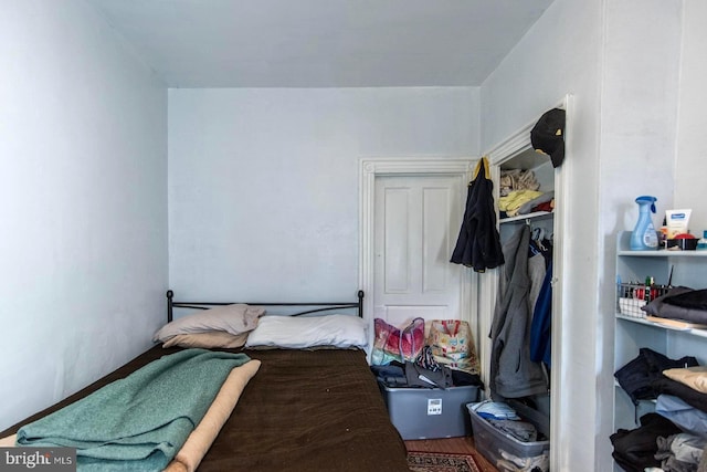 bedroom with wood finished floors