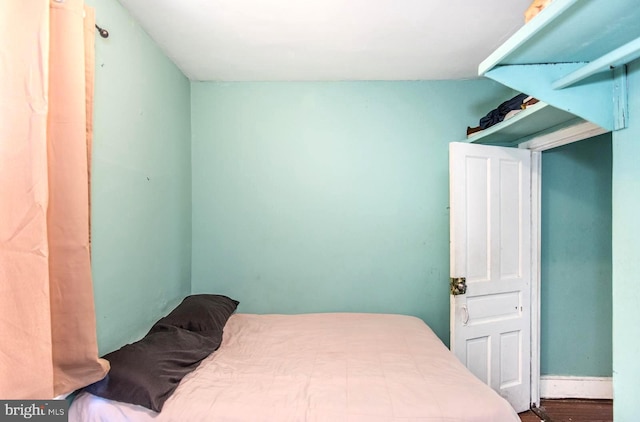 bedroom featuring wood finished floors