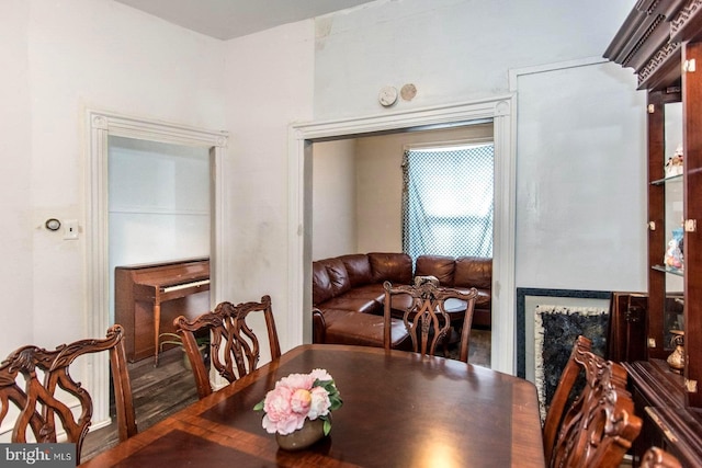 dining space with wood finished floors