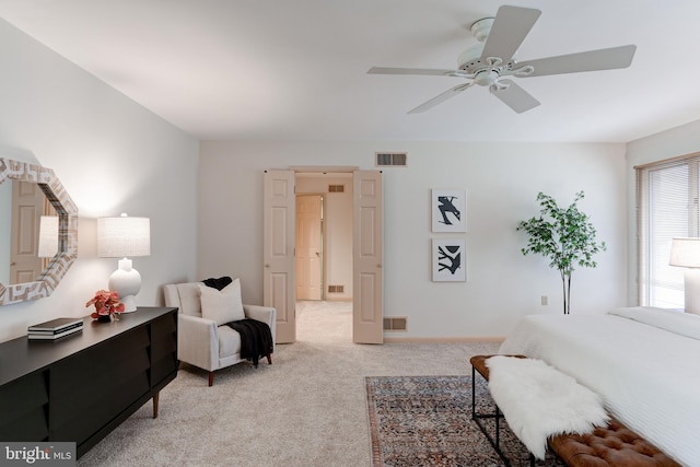 bedroom featuring light carpet and visible vents