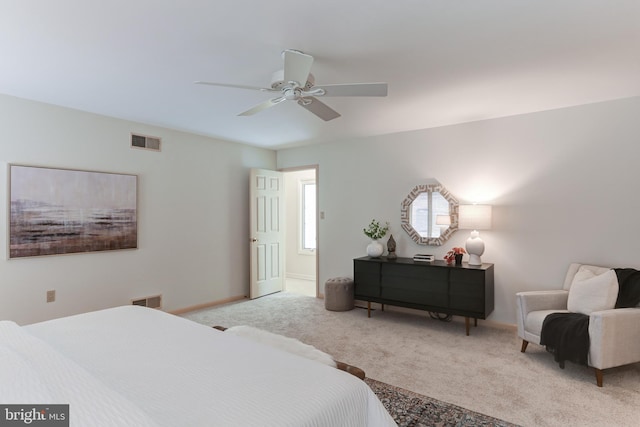 bedroom featuring carpet flooring, baseboards, visible vents, and ceiling fan