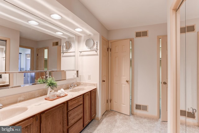 bathroom featuring a sink and visible vents