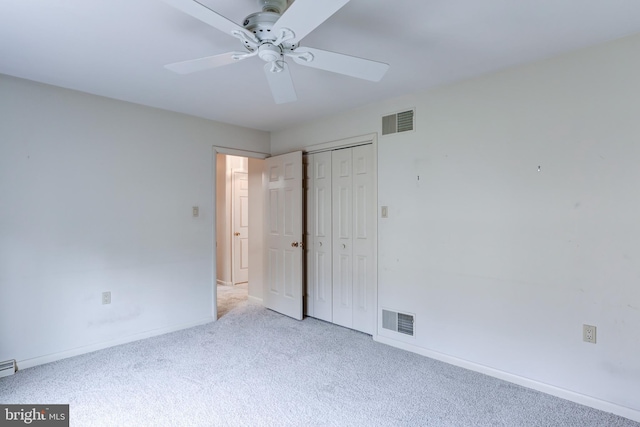 unfurnished bedroom with visible vents, baseboards, a closet, and carpet flooring