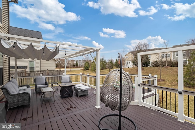 wooden deck with an outdoor hangout area and a pergola